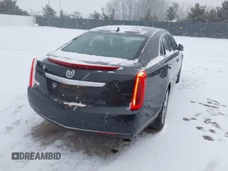 2013 Cadillac XTS with VIN 2G61N5S37D9112979, listed as a IAAI auction lot 41209826 with 83,237 mi miles. Bid and sale history available at carsss.com. Image 4.