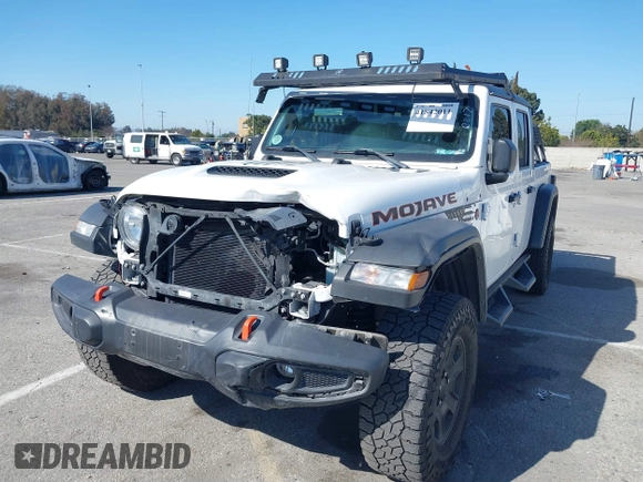 2022 Jeep Gladiator Mojave z VIN 1C6JJTEG0NL103523, wystawiony jako IAAI lot #41842011 z przebiegiem 36 160 mil mil oraz . Historia ofert i sprzedaży dostępna na DreamBid. Obrazek 2.