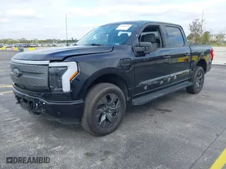 2023 Ford F-150 Lightning Pro with VIN 1FTVW1ELXPWG15885, listed as a IAAI auction lot 41631871 with 88,151 mi miles. Bid and sale history available at carsss.com. Image 21.