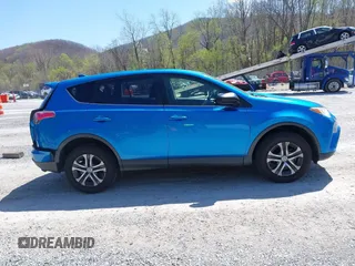 2018 Toyota RAV4 LE with VIN JTMZFREV4JJ734702, listed as a IAAI auction lot 41987540 with 141,526 mi miles. Bid and sale history available at carsss.com. Image 13.