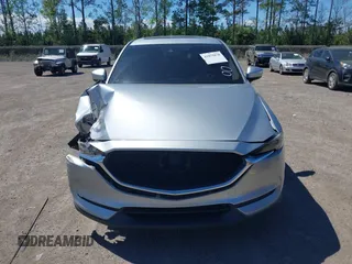 2019 Mazda CX-5 Grand Touring with VIN JM3KFADM1K1606082, listed as a IAAI auction lot 41875878 with 66,089 mi miles. Bid and sale history available at carsss.com. Image 12.