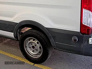 2018 Ford Transit with VIN 1FTBW2ZM8JKA77066, listed as a IAAI auction lot 42642396 with 215,234 mi miles and . Bid and sale history available at DreamBid. Image 28.