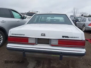 1991 Mercury Grand Marquis z VIN 2MECM75F2MX678620, wystawiony jako IAAI lot #41545796 z przebiegiem 52 567 mil mil oraz . Historia ofert i sprzedaży dostępna na DreamBid. Obrazek 16.