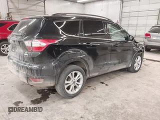 2018 Ford Escape SE z VIN 1FMCU9GD0JUC25636, wystawiony jako IAAI lot #40996760 z przebiegiem 70 097 mil mil oraz . Historia ofert i sprzedaży dostępna na DreamBid. Obrazek 4.
