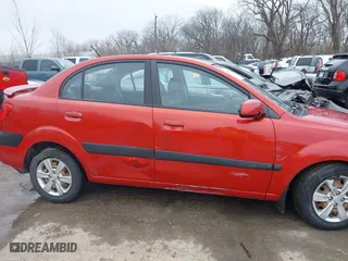 2009 Kia Rio SX with VIN KNADE223796561406, listed as a IAAI auction lot 41650749 with 100,041 mi miles. Bid and sale history available at carsss.com. Image 6.
