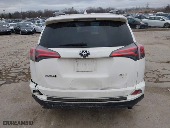 2018 Toyota RAV4 XLE with VIN JTMRFREV6JJ734927, listed as a IAAI auction lot 41510616 with 119,687 mi miles. Bid and sale history available at carsss.com. Image 16.