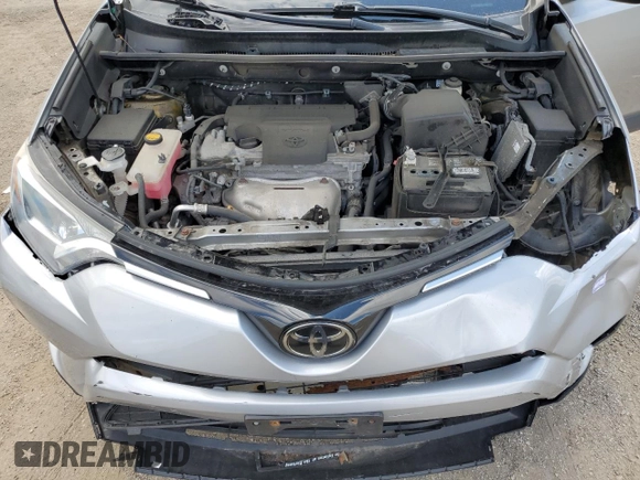 2018 Toyota RAV4 LE with VIN 2T3BFREV8JW788362, listed as a Copart auction lot 64053735 with 124,668 mi miles and Salvage title. Bid and sale history available at DreamBid. Image 12.