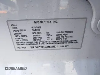 2021 Tesla Model Y Long Range with VIN 5YJYGDEE7MF224531, listed as a IAAI auction lot 38454442 with 52,408 mi miles. Bid and sale history available at carsss.com. Image 9.