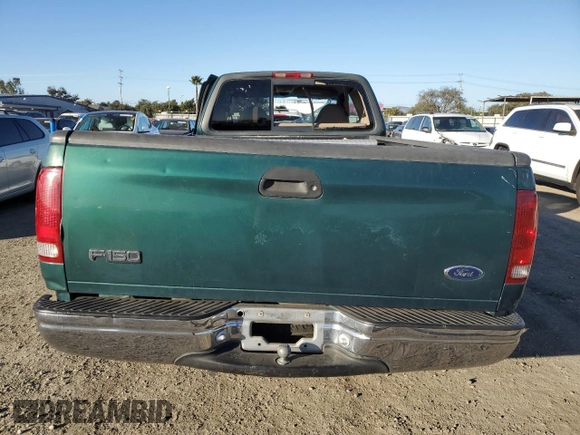 2000 Ford F-150 XL with VIN 1FTRX17W4YNB17453, listed as a Copart auction lot 52051215 with Not provided miles and Salvage title. Bid and sale history available at DreamBid. Image 6.