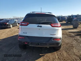 2017 Jeep Cherokee Trailhawk L Plus with VIN 1C4PJMBB3HW506965, listed as a Copart auction lot 82257594 with 106,571 mi miles and Salvage title. Bid and sale history available at DreamBid. Image 6.