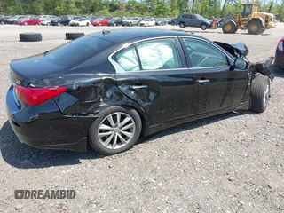 2015 Infiniti Q50 Premium z VIN JN1BV7AR4FM410949, wystawiony jako IAAI lot #42243917 z przebiegiem 56 552 mil mil oraz . Historia ofert i sprzedaży dostępna na DreamBid. Obrazek 4.