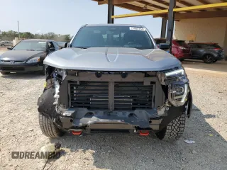 2024 GMC Canyon 4WD AT4 with VIN 1GTP6DEK9R1116173, listed as a Copart auction lot 71005134 with 5,298 mi miles and Salvage Title. Bid and sale history available at carsss.com. Image 5.