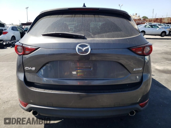 2019 Mazda CX-5 Grand Touring with VIN JM3KFADM6K1641992, listed as a Copart auction lot 57862345 with 37,100 mi miles and Salvage title. Bid and sale history available at DreamBid. Image 6.