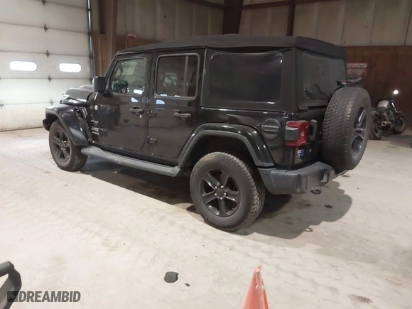 2019 Jeep Wrangler Unlimited Sahara with VIN 1C4HJXEG9KW579682, listed as a IAAI auction lot 41310472 with 74,265 mi miles. Bid and sale history available at carsss.com. Image 3.