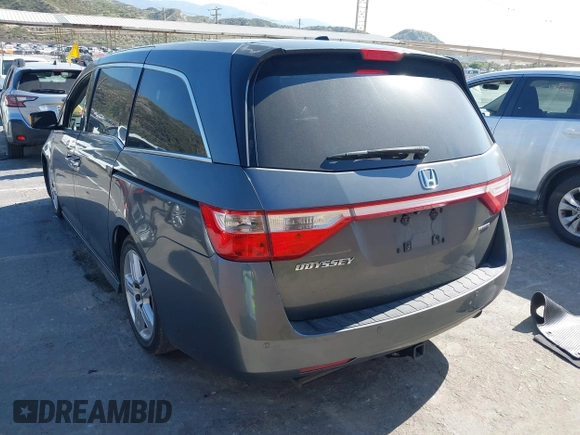 2011 Honda Odyssey Touring with VIN 5FNRL5H96BB009580, listed as a IAAI auction lot 42202595 with Not provided miles and . Bid and sale history available at DreamBid. Image 3.