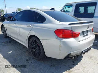2015 BMW 4 Series 428i xDrive with VIN WBA4C9C54FD330582, listed as a IAAI auction lot 42135691 with 127,289 mi miles and . Bid and sale history available at DreamBid. Image 3.