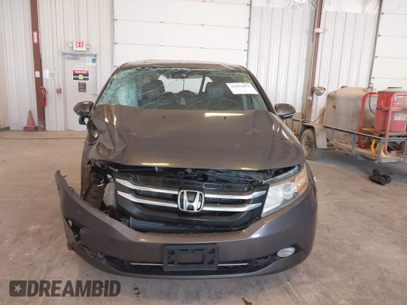 2014 Honda Odyssey Touring with VIN 5FNRL5H99EB105059, listed as a IAAI auction lot 42457672 with 240,581 mi miles and . Bid and sale history available at DreamBid. Image 12.