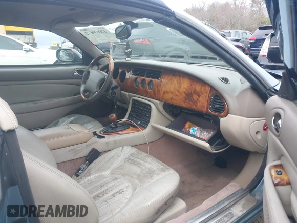 2002 Jaguar XK with VIN SAJDA42CX2NA28816, listed as a IAAI auction lot 42029672 with 130,978 mi miles and . Bid and sale history available at DreamBid. Image 5.