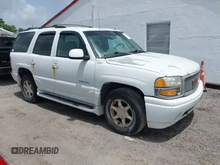 2002 GMC Yukon Denali z VIN 1GKEK63UX2J216442, wystawiony jako IAAI lot #42391575 z przebiegiem 122 668 mil mil oraz . Historia ofert i sprzedaży dostępna na DreamBid. Obrazek 1.