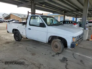 1995 Nissan Frontier with VIN 1N6SD11S3SC379478, listed as a Copart auction lot 52209415 with 21,068 mi miles and Salvage title. Bid and sale history available at DreamBid. Image 4.