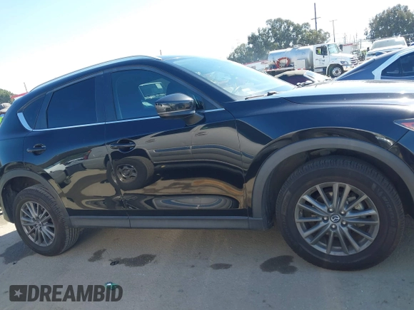 2019 Mazda CX-5 Sport with VIN JM3KFABM7K1579747, listed as a IAAI auction lot 41965097 with 151,042 mi miles and . Bid and sale history available at DreamBid. Image 14.