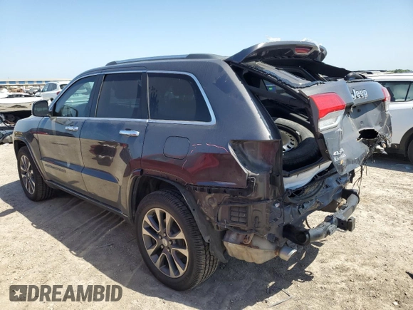2017 Jeep Grand Cherokee Overland with VIN 1C4RJFCGXHC941983, listed as a Copart auction lot 52008825 with 65,776 mi miles and Salvage Title. Bid and sale history available at carsss.com. Image 2.