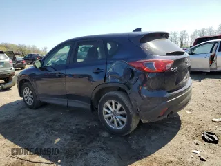 2014 Mazda CX-5 Touring with VIN JM3KE4CY4E0407868, listed as a Copart auction lot 52564315 with 137,989 mi miles and Salvage Title. Bid and sale history available at carsss.com. Image 2.