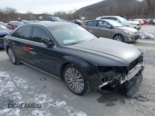 2015 Audi A8 L 4.0T with VIN WAU32AFD7FN006233, listed as a IAAI auction lot 41353034 with 119,693 mi miles. Bid and sale history available at carsss.com. Image 1.