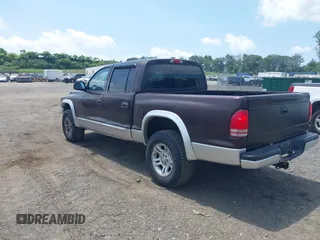 2004 Dodge Dakota SLT with VIN 1D7HG48NX4S649522, listed as a IAAI auction lot 42580132 with 124,037 mi miles and . Bid and sale history available at DreamBid. Image 3.