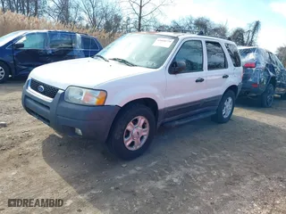 2003 Ford Escape XLT Popular 2 with VIN 1FMCU93163KB78008, listed as a IAAI auction lot 41660779 with 153,898 mi miles. Bid and sale history available at carsss.com. Image 2.