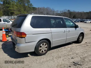 2004 Honda Odyssey EX-L with VIN 5FNRL18974B074613, listed as a Copart auction lot 48924865 with 212,633 mi miles and Salvage Title. Bid and sale history available at DreamBid. Image 3.