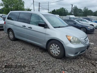 2010 Honda Odyssey LX with VIN 5FNRL3H2XAB059078, listed as a Copart auction lot 61144895 with 116,724 mi miles and Salvage title. Bid and sale history available at DreamBid. Image 4.