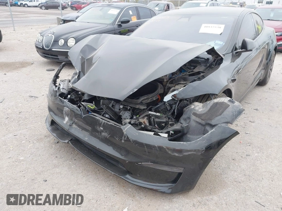 2022 Tesla Model S Plaid with VIN 5YJSA1E65NF484149, listed as a IAAI auction lot 40937538 with 11,459 mi miles and . Bid and sale history available at DreamBid. Image 6.
