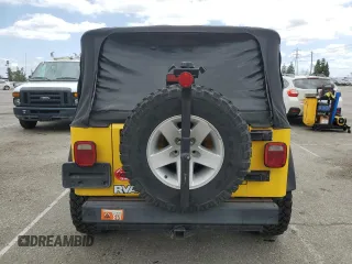 2004 Jeep Wrangler Rubicon with VIN 1J4FA69SX4P768963, listed as a Copart auction lot 56999665 with 91,949 mi miles and Salvage title. Bid and sale history available at DreamBid. Image 6.