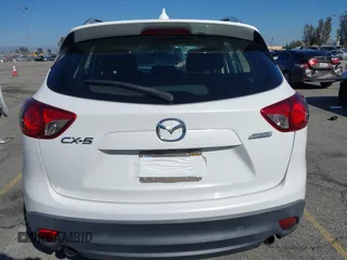 2016 Mazda CX-5 Sport with VIN JM3KE2BY9G0879654, listed as a IAAI auction lot 41819154 with 65,586 mi miles. Bid and sale history available at carsss.com. Image 16.