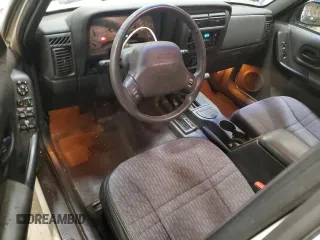 2000 Jeep Cherokee z VIN 1J4FF48S2YL104094, wystawiony jako Copart lot #57347705 z przebiegiem 75 948 mil mil oraz Nie do naprawy • Non repairable. Historia ofert i sprzedaży dostępna na DreamBid. Obrazek 8.