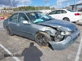 1996 Honda Accord LX with VIN 1HGCD5634TA291036, listed as a IAAI auction lot 41583543 with 166,725 mi miles and . Bid and sale history available at carsss.com. Image 1.