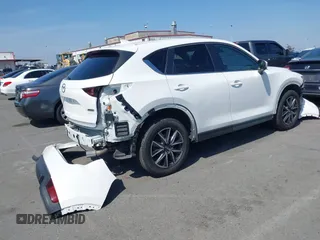 2018 Mazda CX-5 Touring with VIN JM3KFACM0J0416716, listed as a IAAI auction lot 42150121 with 61,332 mi miles and . Bid and sale history available at carsss.com. Image 4.