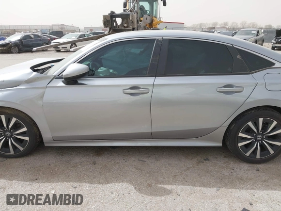 2023 Honda Civic EX with VIN 2HGFE1F77PH321210, listed as a IAAI auction lot 41797011 with 8,748 mi miles and . Bid and sale history available at DreamBid. Image 14.