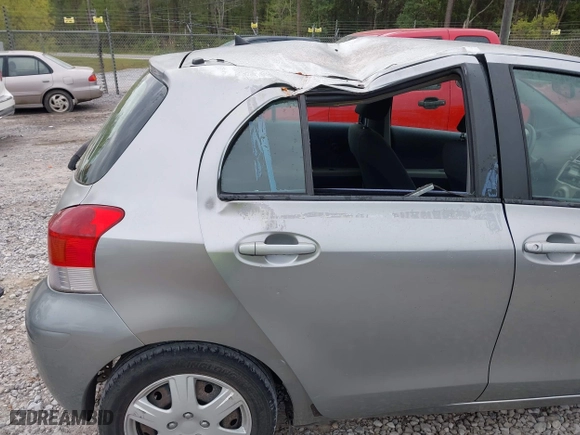 2010 Toyota Yaris with VIN JTDKT4K38A5296999, listed as a IAAI auction lot 41878127 with 122,692 mi miles. Bid and sale history available at carsss.com. Image 6.