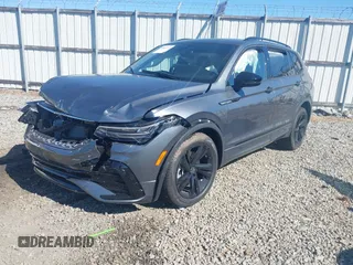 2024 Volkswagen Tiguan SE R-Line Black with VIN 3VVCB7AX2RM114556, listed as a IAAI auction lot 41887373 with 7,013 mi miles and . Bid and sale history available at DreamBid. Image 2.