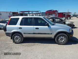 2000 Honda CR-V LX with VIN JHLRD2846YC009880, listed as a IAAI auction lot 41830061 with 263,177 mi miles. Bid and sale history available at carsss.com. Image 12.