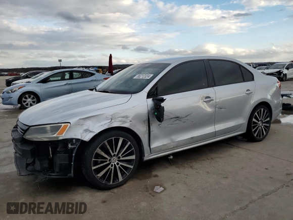 2014 Volkswagen Jetta Sedan S with VIN 3VW2K7AJ0EM311044, listed as a Copart auction lot 85212324 with 128,521 mi miles and Salvage Title. Bid and sale history available at carsss.com. Image 1.