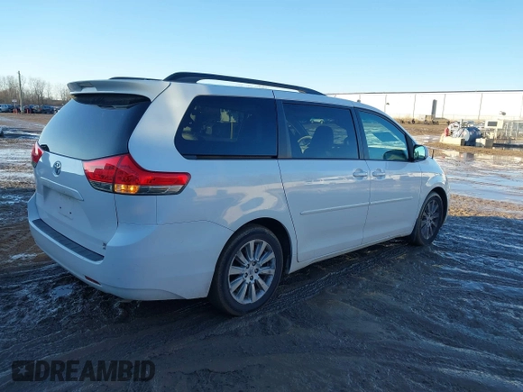 2012 Toyota Sienna XLE with VIN 5TDDK3DC4CS042464, listed as a IAAI auction lot 41199300 with 143,677 mi miles. Bid and sale history available at carsss.com. Image 4.