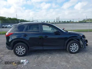 2014 Mazda CX-5 Touring with VIN JM3KE2CYXE0384987, listed as a IAAI auction lot 42052196 with 151,765 mi miles. Bid and sale history available at carsss.com. Image 13.