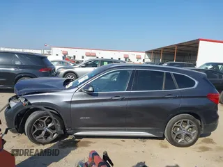 2016 BMW X1 xDrive28i with VIN WBXHT3Z35G4A49941, listed as a IAAI auction lot 41789774 with 111,661 mi miles and . Bid and sale history available at DreamBid. Image 14.