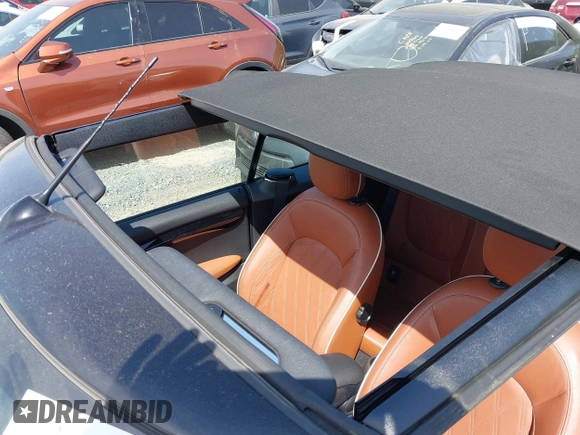 2021 MINI Convertible with VIN WMWWJ9C0XM3M07302, listed as a IAAI auction lot 42027854 with 30,921 mi miles and . Bid and sale history available at DreamBid. Image 19.