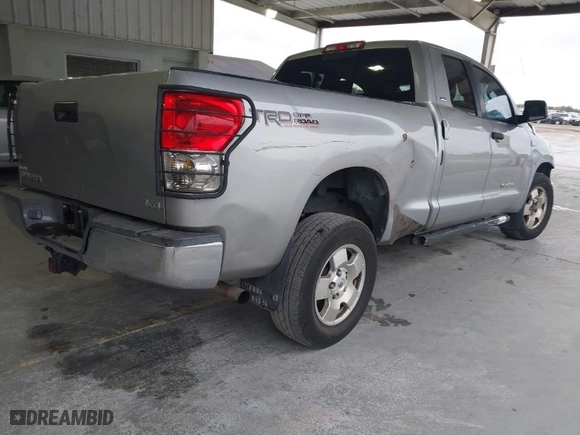 2007 Toyota Tundra SR5 with VIN 5TBBT541X7S453008, listed as a IAAI auction lot 41380611 with 153,181 mi miles. Bid and sale history available at carsss.com. Image 4.