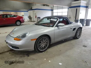 2000 Porsche Boxster z VIN WP0CA2986YU620662, wystawiony jako Copart lot #86589284 z przebiegiem 38 920 mil mil oraz Szkody całkowita. Historia ofert i sprzedaży dostępna na DreamBid. Obrazek 1.