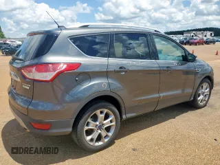 2015 Ford Escape Titanium with VIN 1FMCU0J92FUB80769, listed as a Copart auction lot 61988435 with 103,212 mi miles and Salvage title. Bid and sale history available at DreamBid. Image 3.